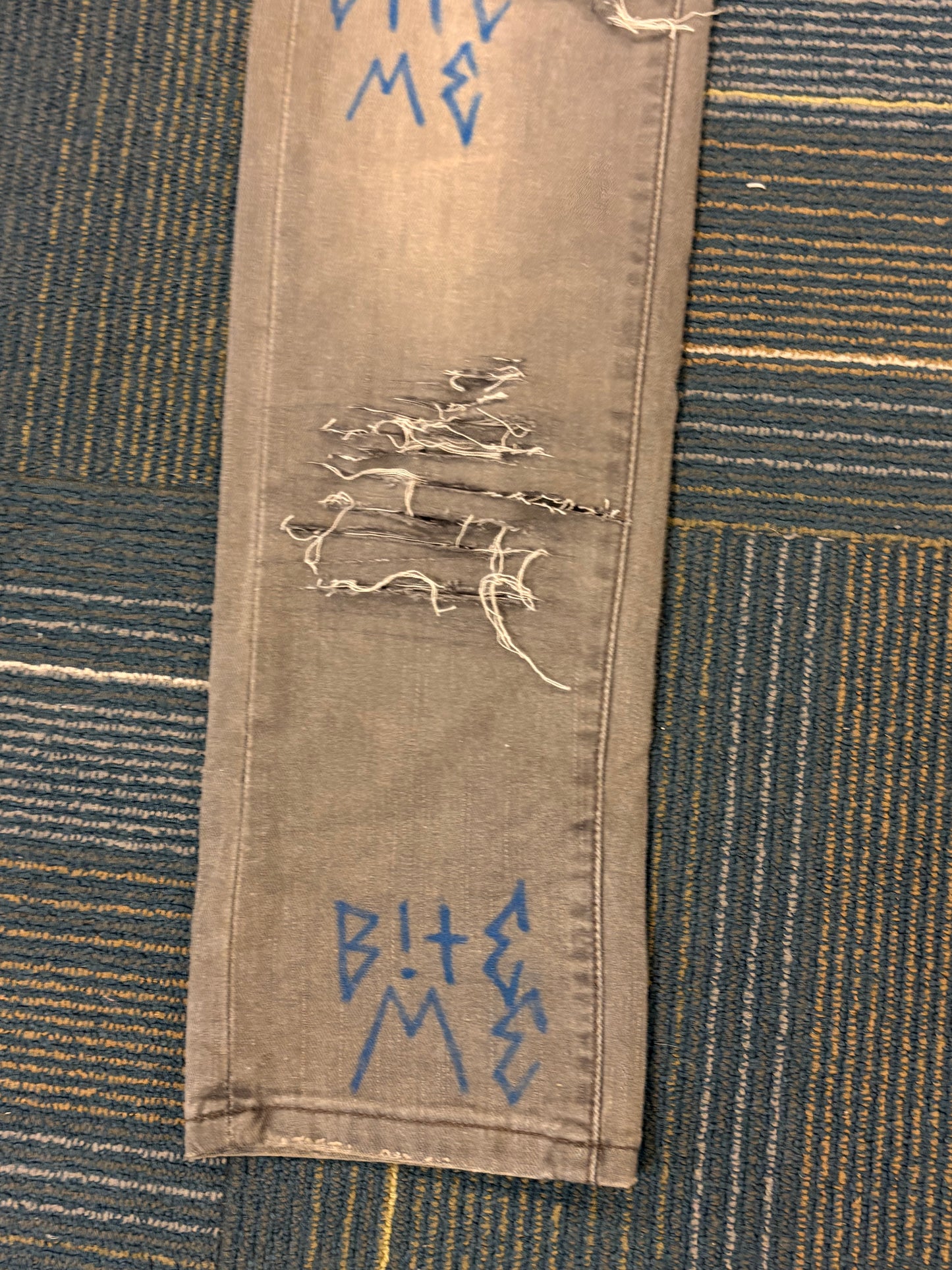 "Bite Me' Distressed Skinny Jeans